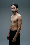 man wearing leather ball gag