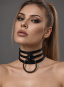 woman wearing a black leather bdsm collar with a large ring at the front, set against a grey background