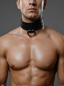 man wearing a black studded leather collar with D-ring at the front,